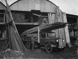 A Walter Lane Bedford lorry loads up with planks of wood at their sawmill in Sidcup A Walter Lane Bedford lorry loads up with planks of wood at their sawmill in Sidcup