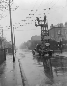 Workers from the Demolition and Construction Company Ltd use their Bedford Tram Tower Workers from the Demolition and Construction Company Ltd use their Bedford Tram Tower