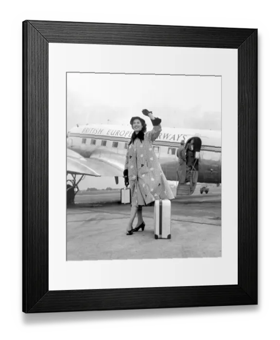 Framed Print : Canasta, the smart weather coat of the season. It is weatherproof and smart and gay