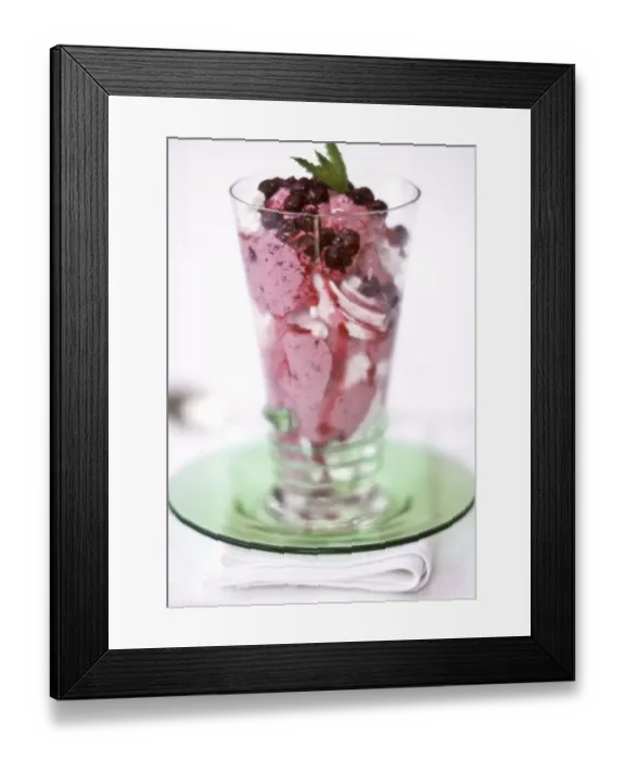 Framed Print : Spectacular dessert of ice cream with blackcurrants and fresh fruit coulis topped Framed Print : Spectacular dessert of ice cream with blackcurrants and fresh fruit coulis topped