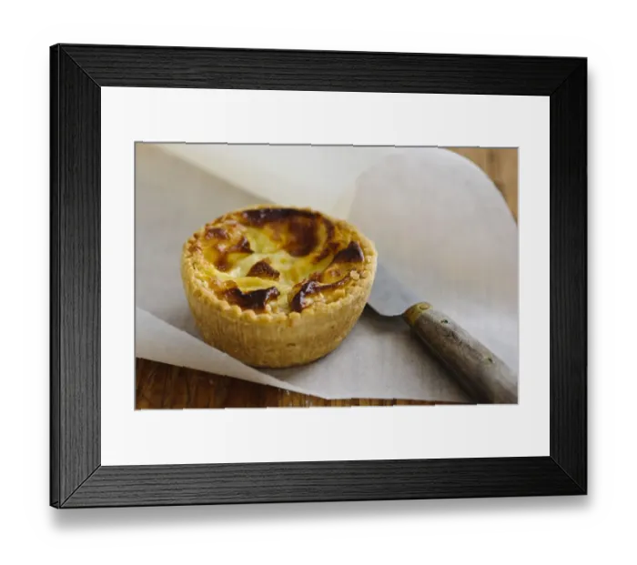 Framed Print : Little Quiche Lorraine on curled greaseproof paper with knife credit: Marie-Louise Framed Print : Little Quiche Lorraine on curled greaseproof paper with knife credit: Marie-Louise