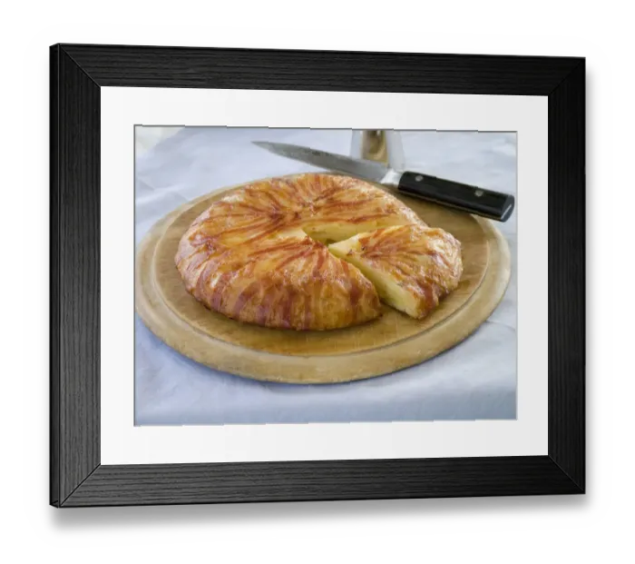 Framed Print : Potato galette wrapped in bacon on wooden board with knife credit: Marie-Louise Framed Print : Potato galette wrapped in bacon on wooden board with knife credit: Marie-Louise