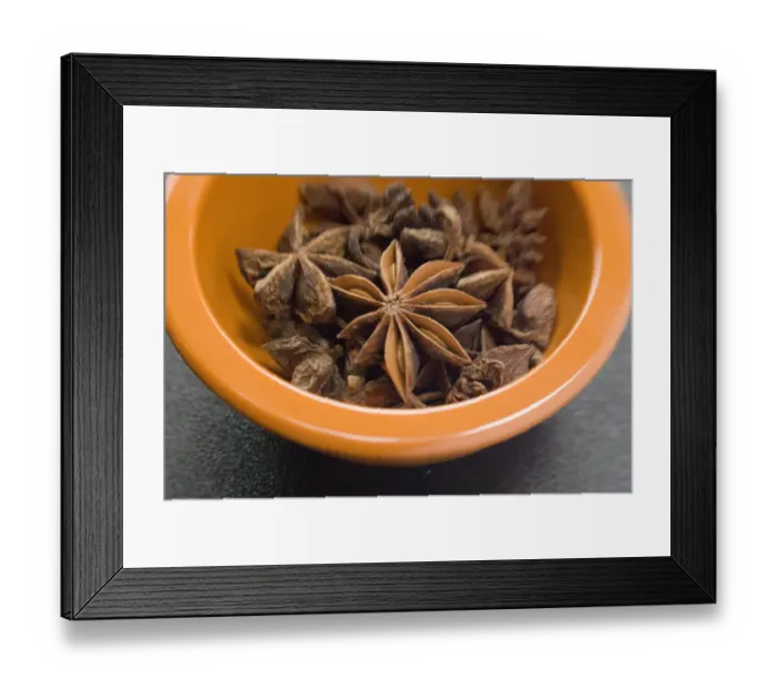 Framed Print : Dried Star anise fruits in small bowl. Also known as star aniseed, badiane or Chinese Framed Print : Dried Star anise fruits in small bowl. Also known as star aniseed, badiane or Chinese