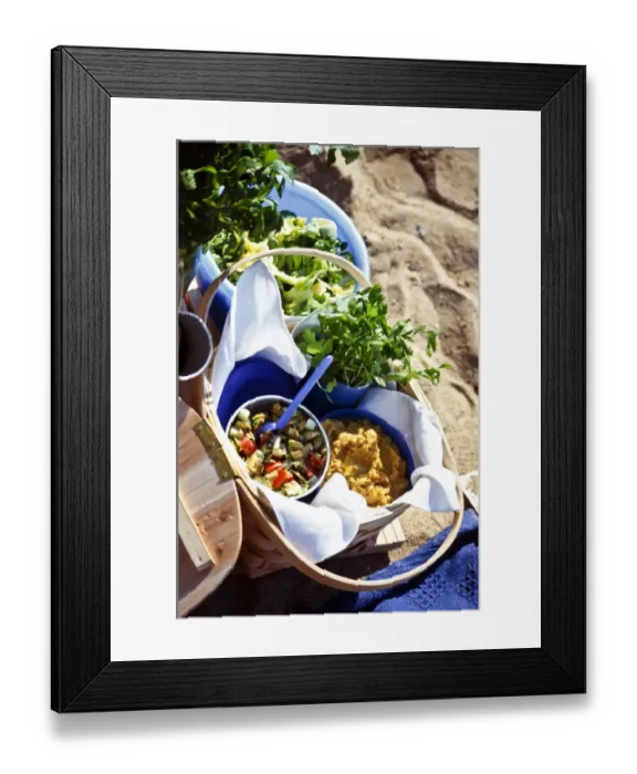 Framed Print : Beach picnic with salads in bowls and baskets credit: Marie-Louise Avery / thePictureKitchen Framed Print : Beach picnic with salads in bowls and baskets credit: Marie-Louise Avery / thePictureKitchen