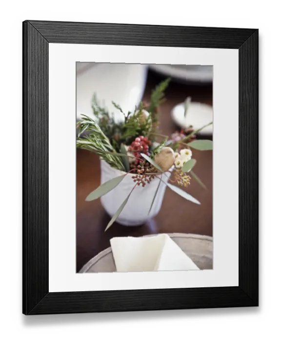 Framed Print : Table decoration of herbs, berries and greenery on small white cup credit: Marie-Louise