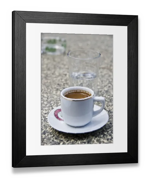 Framed Print : Greek coffee and glass of water on table of restaurant in Cyprus hills. credit Framed Print : Greek coffee and glass of water on table of restaurant in Cyprus hills. credit