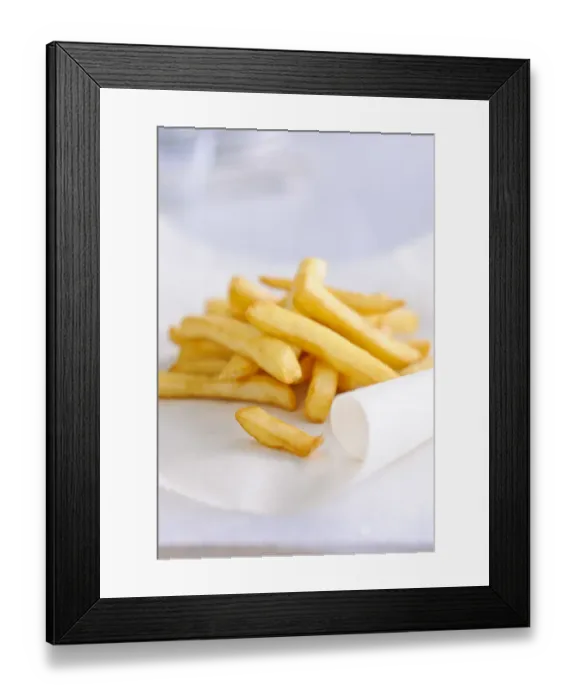 Framed Print : Pile of french fries on greaseproof paper credit: Marie-Louise Avery / thePictureKitchen Framed Print : Pile of french fries on greaseproof paper credit: Marie-Louise Avery / thePictureKitchen