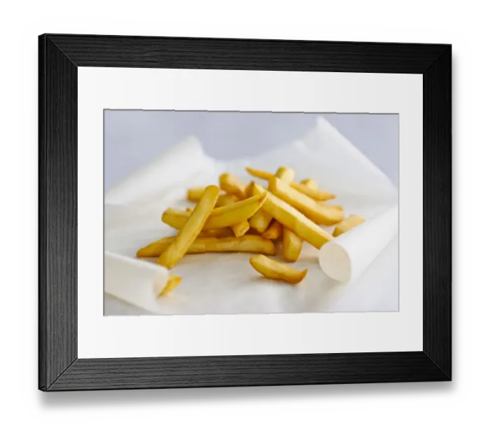 Framed Print : Pile of french fries on greaseproof paper credit: Marie-Louise Avery / thePictureKitchen Framed Print : Pile of french fries on greaseproof paper credit: Marie-Louise Avery / thePictureKitchen