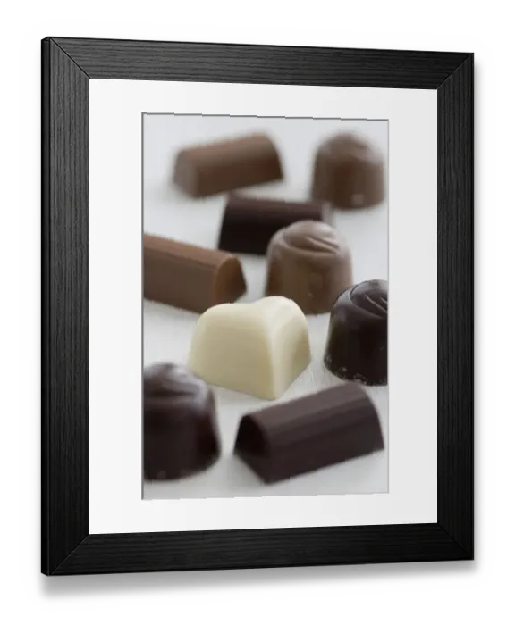 Framed Print : A selection of white, dark, and milk chocolates on white surface. credit: Marie-Louise Framed Print : A selection of white, dark, and milk chocolates on white surface. credit: Marie-Louise