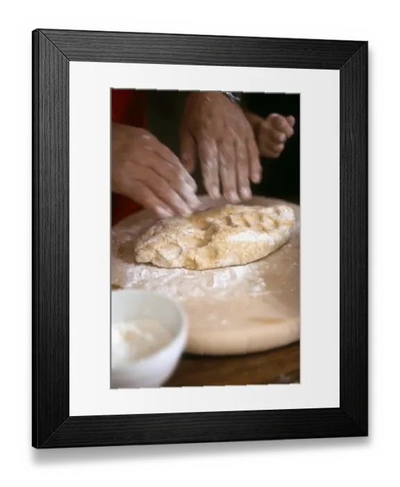 Framed Print : Man kneading and rolling pastry with little girl helping - hands only shown credit Framed Print : Man kneading and rolling pastry with little girl helping - hands only shown credit