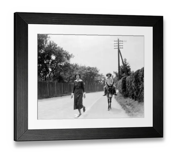Framed Print : Going to school on a donkey. 1933 Framed Print : Going to school on a donkey. 1933