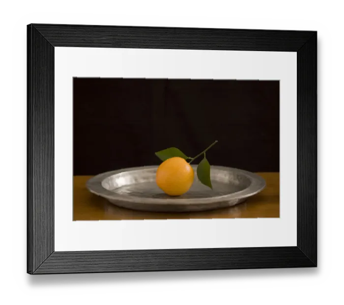 Framed Print : Orange with leaves on pewter charger credit: Marie-Louise Avery / thePictureKitchen Framed Print : Orange with leaves on pewter charger credit: Marie-Louise Avery / thePictureKitchen