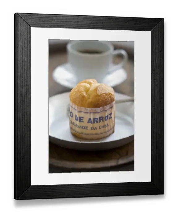 Framed Print : Classic Portuguese muffin type cake made with rice in paper wrapper on metal plate Framed Print : Classic Portuguese muffin type cake made with rice in paper wrapper on metal plate