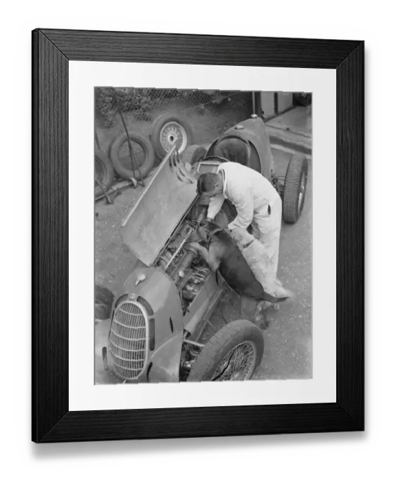 Framed Print : A racing driver and two dogs check the engine of a racing car. 1939 Framed Print : A racing driver and two dogs check the engine of a racing car. 1939