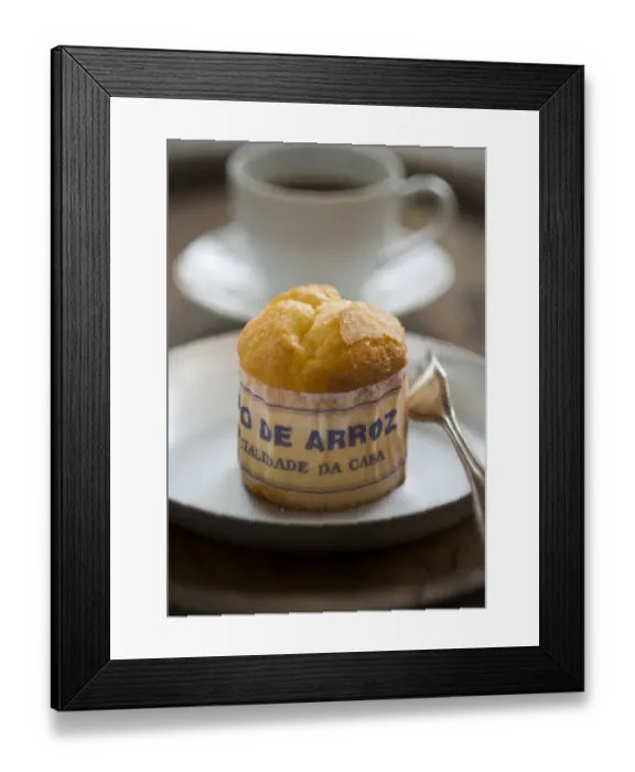 Framed Print : Classic Portuguese muffin type cake made with rice in paper wrapper on metal plate