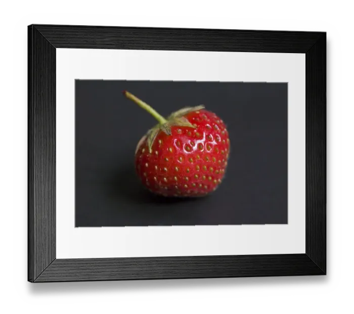 Framed Print : Single strawberry on a black plate credit: Marie-Louise Avery / thePictureKitchen Framed Print : Single strawberry on a black plate credit: Marie-Louise Avery / thePictureKitchen
