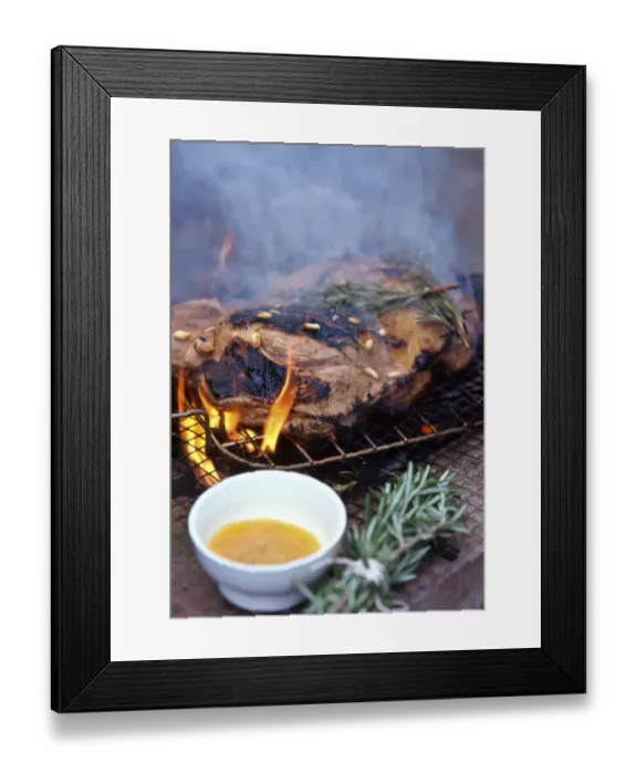 Framed Print : Leg of lamb, butterflied to flatten being barbecued on charcoal grill with rosemary Framed Print : Leg of lamb, butterflied to flatten being barbecued on charcoal grill with rosemary