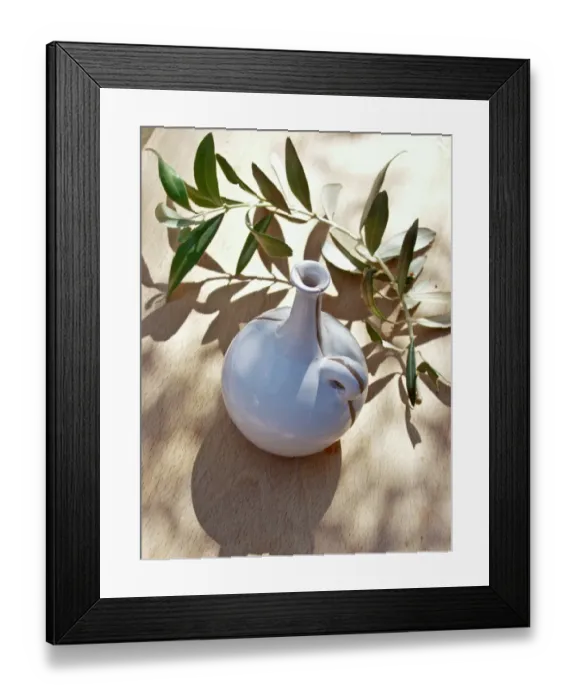 Framed Print : Ceramic oil bottle on tabled dappled in Italian sunshine with branch from olive tree Framed Print : Ceramic oil bottle on tabled dappled in Italian sunshine with branch from olive tree