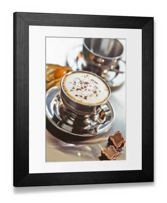 Framed Print : Stainless steel cup of cappucino on metal counter with chocolate fudge and pthysalis Framed Print : Stainless steel cup of cappucino on metal counter with chocolate fudge and pthysalis