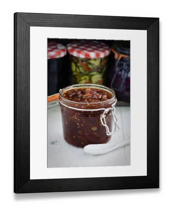 Framed Print : Home made jar of tomato chutney credit: Marie-Louise Avery  /  thePictureKitchen