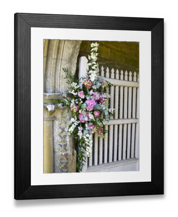 Framed Print : Flower arrangement decorating entrance to country church for summer wedding. credit Framed Print : Flower arrangement decorating entrance to country church for summer wedding. credit