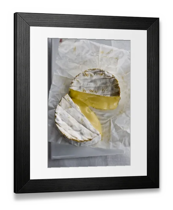 Framed Print : Whole round Camembert cheese cut in half showing ripe runny interior credit: Marie-Louise Framed Print : Whole round Camembert cheese cut in half showing ripe runny interior credit: Marie-Louise