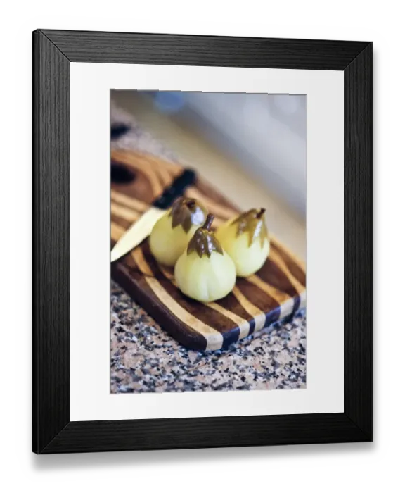 Framed Print : Peeled pears poached in vanilla sugar syrup on striped wooden board credit: Marie-Louise
