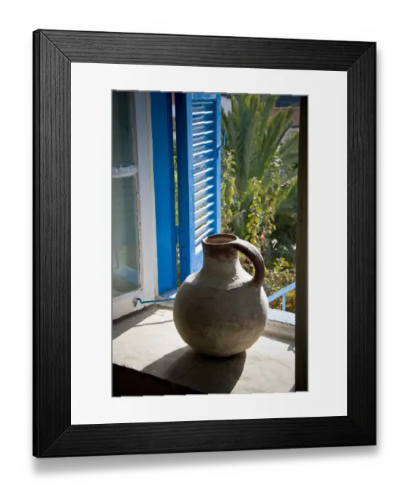 Framed Print : A large earthenware jug on the window sill of a Cypriot house in southern (Greek)