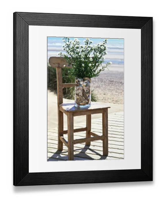 Framed Print : Bunch of michaelmas daisies in pebble filled vase on old chair on decking by Framed Print : Bunch of michaelmas daisies in pebble filled vase on old chair on decking by