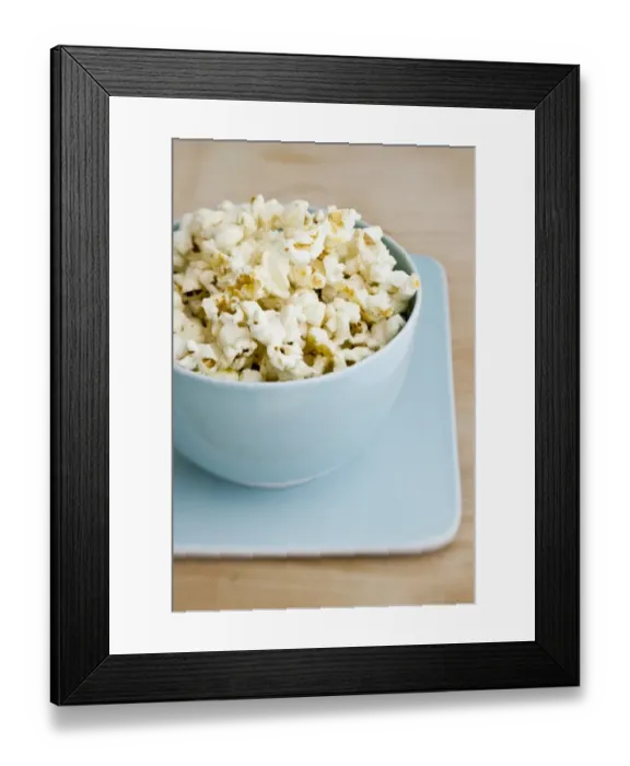 Framed Print : Freshly popped pocorn in pretty blue bowl credit: Marie-Louise Avery / thePictureKitchen Framed Print : Freshly popped pocorn in pretty blue bowl credit: Marie-Louise Avery / thePictureKitchen