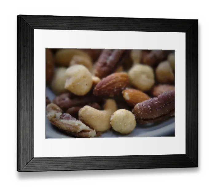 Framed Print : Selection of mixed salted nuts credit: Marie-Louise Avery  /  thePictureKitchen  /  TopFoto