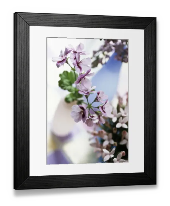 Framed Print : A pretty table arrangement of various mauve and pink small petalled flowers in delicate Framed Print : A pretty table arrangement of various mauve and pink small petalled flowers in delicate