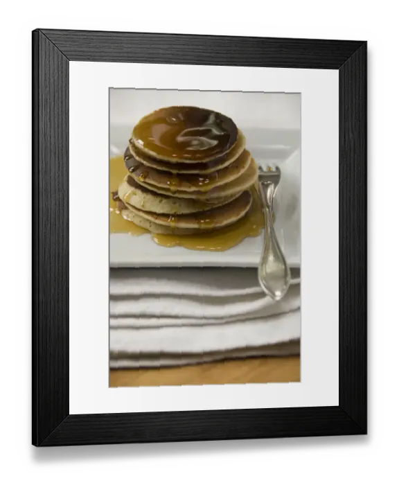 Framed Print : Stack of Scotch pancakes on white plate with silver fork and maple syrup credit Framed Print : Stack of Scotch pancakes on white plate with silver fork and maple syrup credit