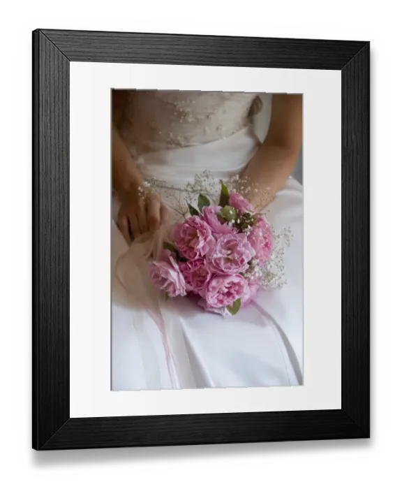 Framed Print : Posy style bridal bouquet held in hands on white satin dress credit: Marie-Louise