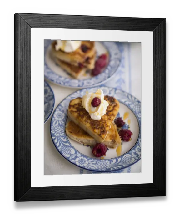 Framed Print : Pancakes made in heart shaped cutters served with whipped cream, raspberries