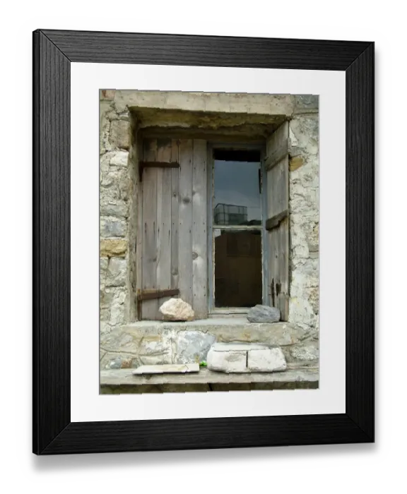 Framed Print : Deep set window in stone building with old weathered shutters held in place with a rock Framed Print : Deep set window in stone building with old weathered shutters held in place with a rock