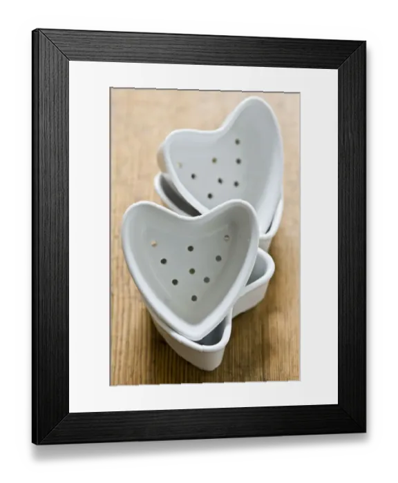 Framed Print : Four couer a la creme moulds stacked on old wooden surface credit: Marie-Louise Framed Print : Four couer a la creme moulds stacked on old wooden surface credit: Marie-Louise