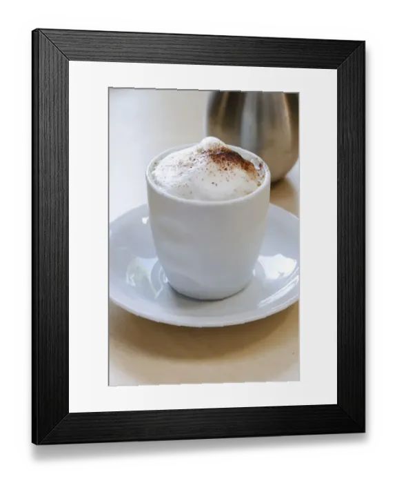 Framed Print : Frothy topped cappuccino in handleless cup with cocoa dusted on and cocoa shaker Framed Print : Frothy topped cappuccino in handleless cup with cocoa dusted on and cocoa shaker
