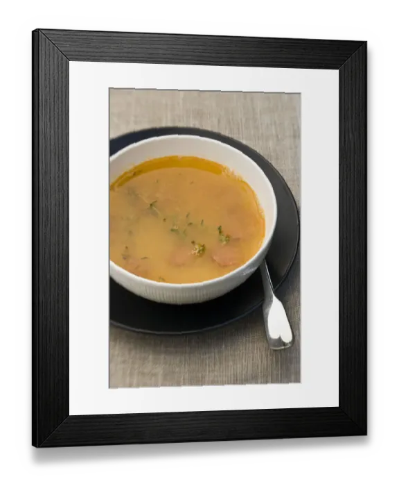 Framed Print : Bowl of warming soup made of yellow split peas, good stock, pieces of chorizo sausage Framed Print : Bowl of warming soup made of yellow split peas, good stock, pieces of chorizo sausage