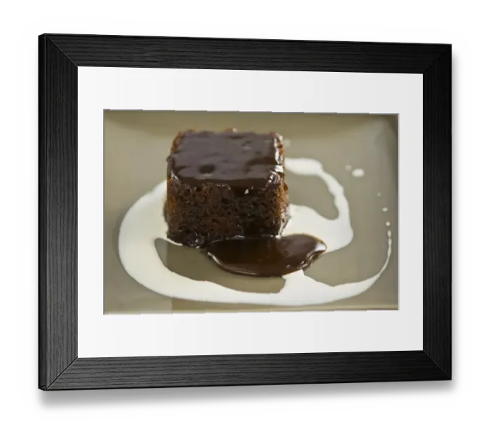 Framed Print : Sticky toffee pudding with cream swirl credit: Marie-Louise Avery / thePictureKitchen Framed Print : Sticky toffee pudding with cream swirl credit: Marie-Louise Avery / thePictureKitchen