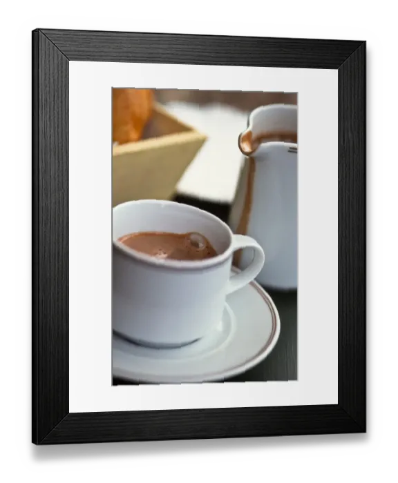 Framed Print : Jug and cup of hot drinking chocolate, on French cafe table credit: Marie-Louise Framed Print : Jug and cup of hot drinking chocolate, on French cafe table credit: Marie-Louise