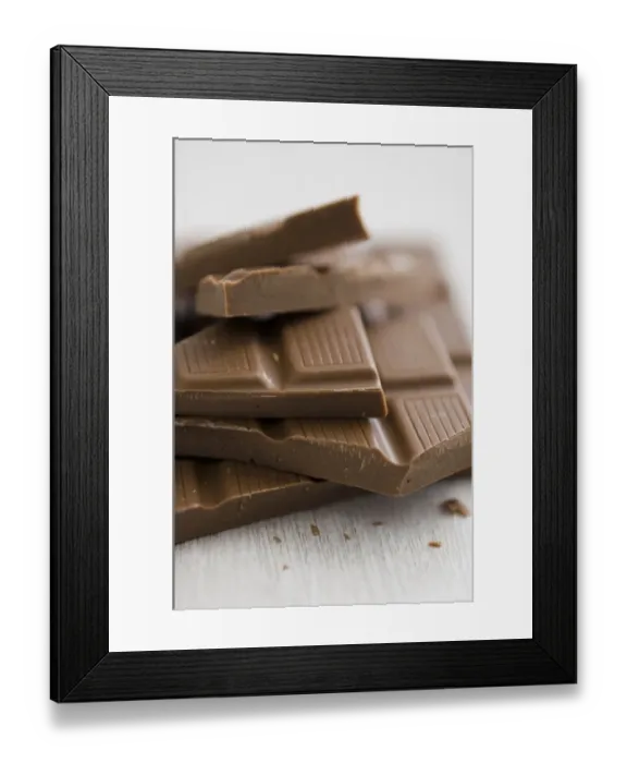 Framed Print : Pile of broken pieces of mik chocolate bar on white surface. credit: Marie-Louise Framed Print : Pile of broken pieces of mik chocolate bar on white surface. credit: Marie-Louise