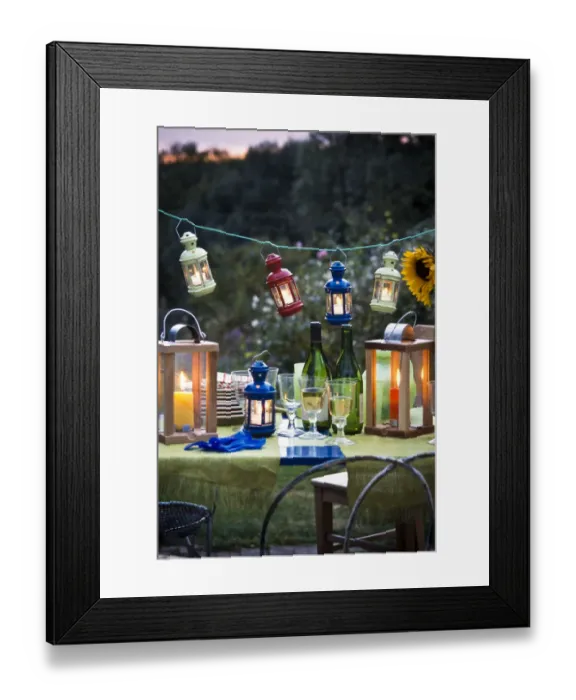 Framed Print : Table laid for a party outside on a summer evening, glasses of white wine with wine Framed Print : Table laid for a party outside on a summer evening, glasses of white wine with wine