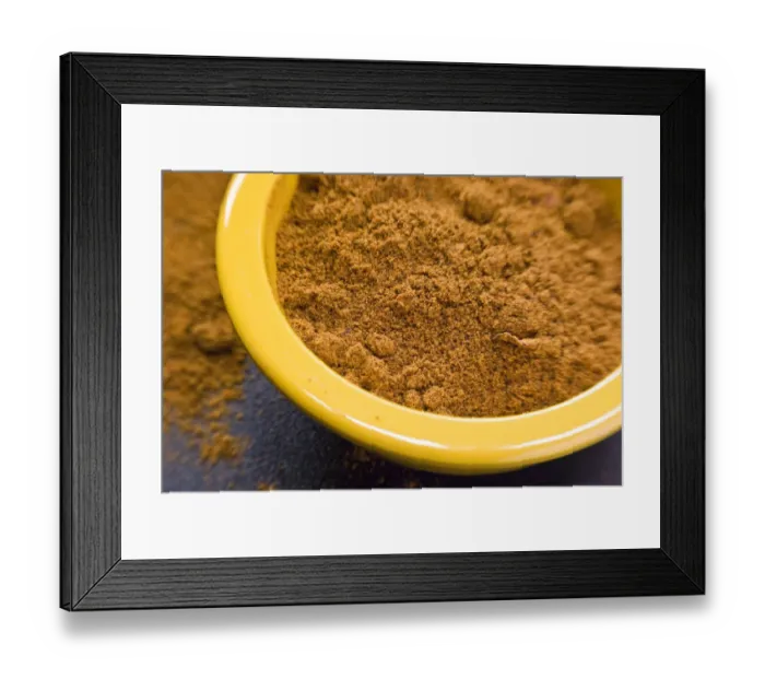 Framed Print : Ras-el-harnout (North African spice mixture), in small yellow bowl credit: Marie-Louise