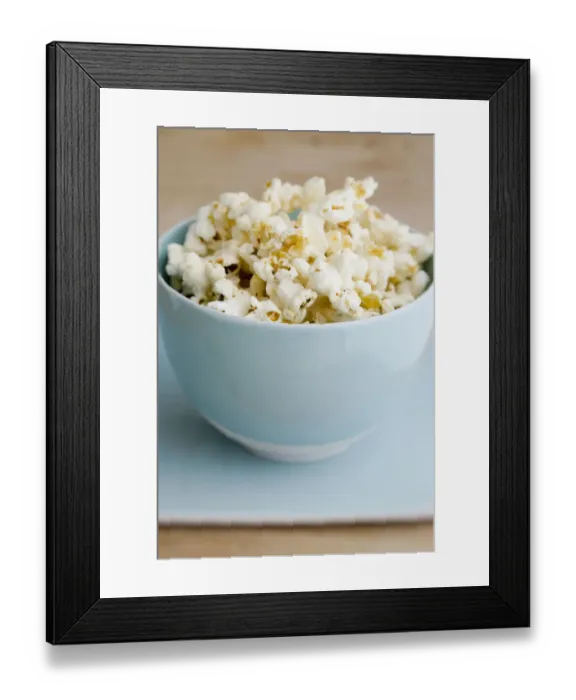 Framed Print : Freshly popped pocorn in pretty blue bowl credit: Marie-Louise Avery / thePictureKitchen Framed Print : Freshly popped pocorn in pretty blue bowl credit: Marie-Louise Avery / thePictureKitchen