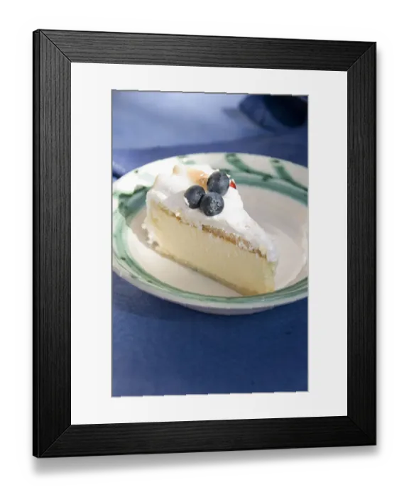 Framed Print : Slice of celebration gateau of light lemon and passionfruit mousse with soft meringue Framed Print : Slice of celebration gateau of light lemon and passionfruit mousse with soft meringue