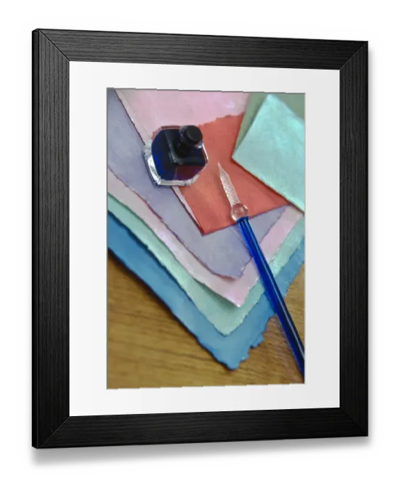 Framed Print : Selection of pastel coloured handmade papers with glass pen and small bottle of ink Framed Print : Selection of pastel coloured handmade papers with glass pen and small bottle of ink
