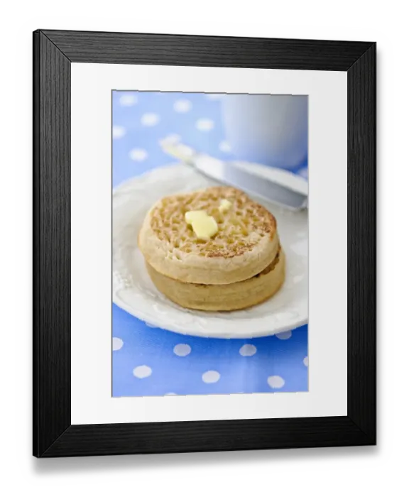 Framed Print : Hot buttered crumpets on white plate credit: Marie-Louise Avery / thePictureKitchen Framed Print : Hot buttered crumpets on white plate credit: Marie-Louise Avery / thePictureKitchen