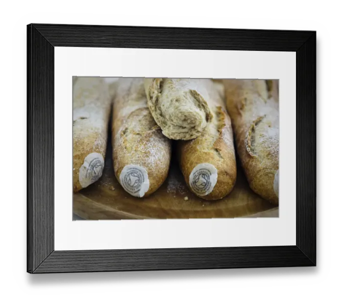 Framed Print : Pile of stoneground wholemeal organic baguettes on woden board credit: Marie-Louise Framed Print : Pile of stoneground wholemeal organic baguettes on woden board credit: Marie-Louise
