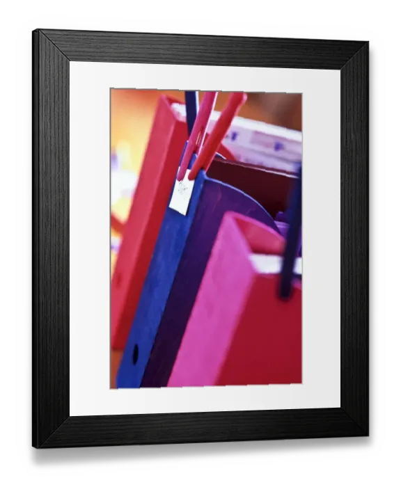 Framed Print : Wooden magazine or literature files stained in bright colours, labelled with wooden